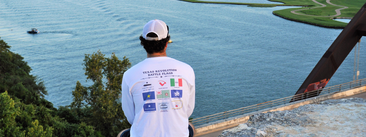 Texas Revolution Battle Flags Shirt on a man overlooking water